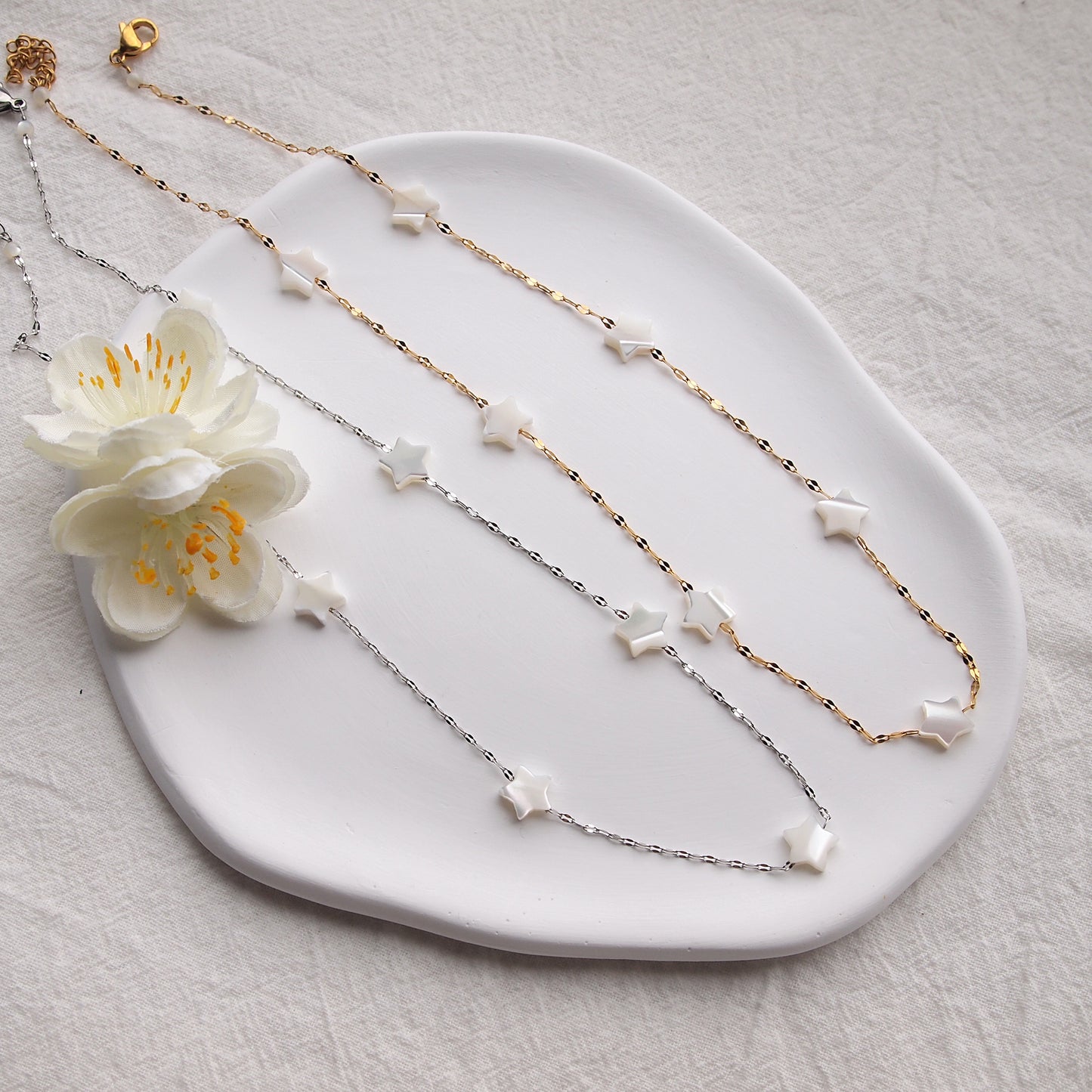 dainty star necklace in gold and silver colors, pearl necklace
