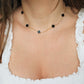everyday woman necklace with black clover charms