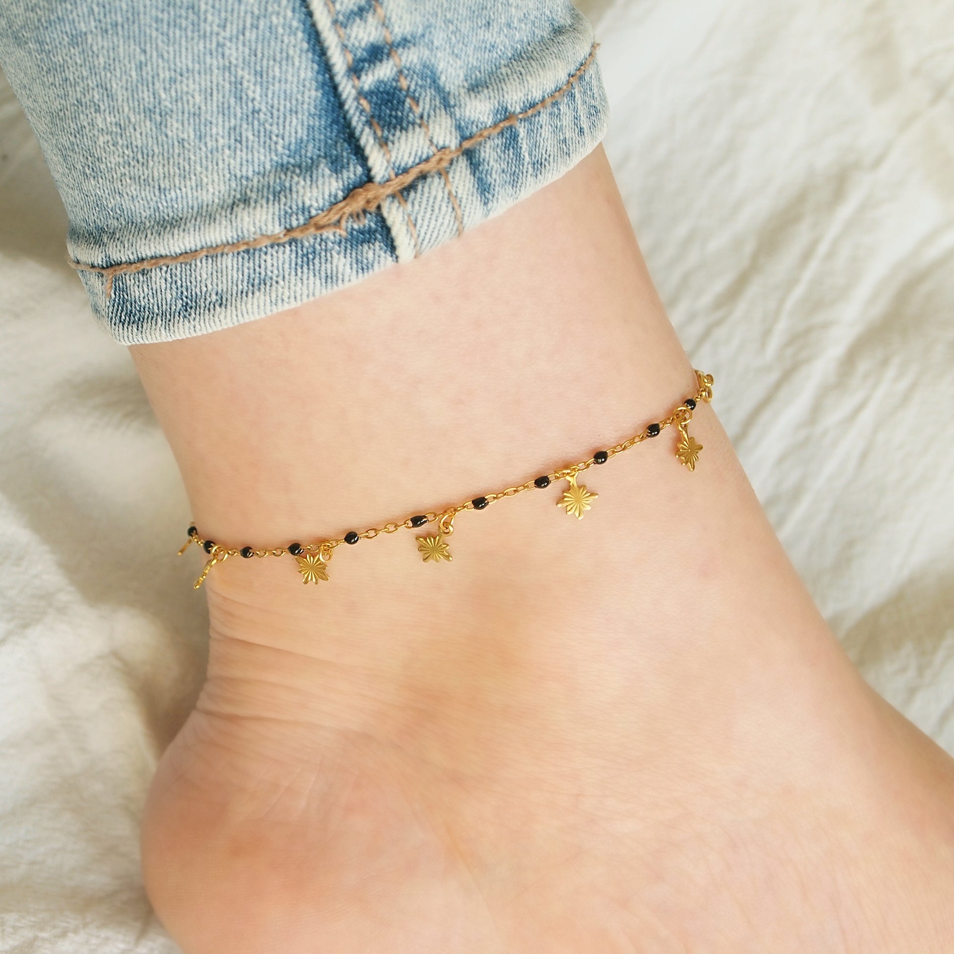 dainty gold anklet with dangling stars