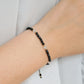 thin black tourmaline bracelet with selenite