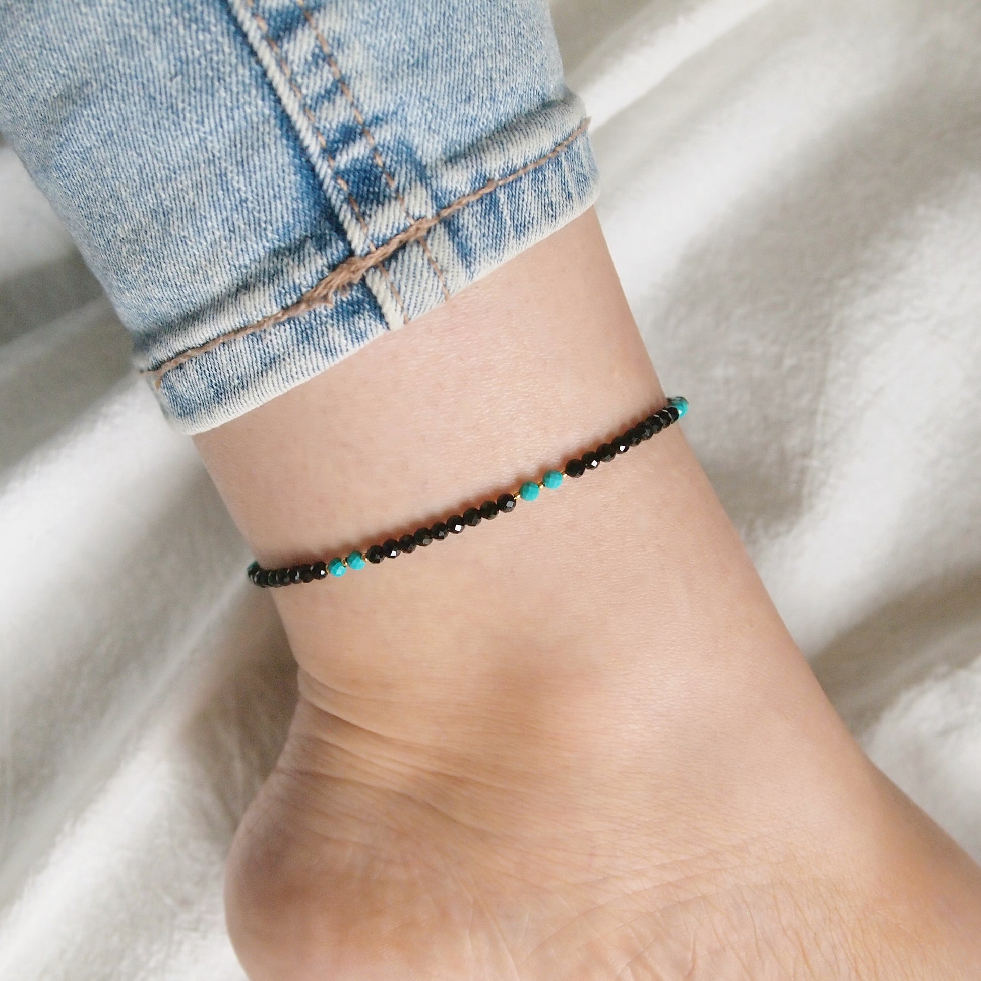 dainty beaded anklet made with black tourmaline and turquoise