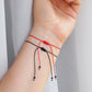 Red string bracelet with evil eye and black tourmaline