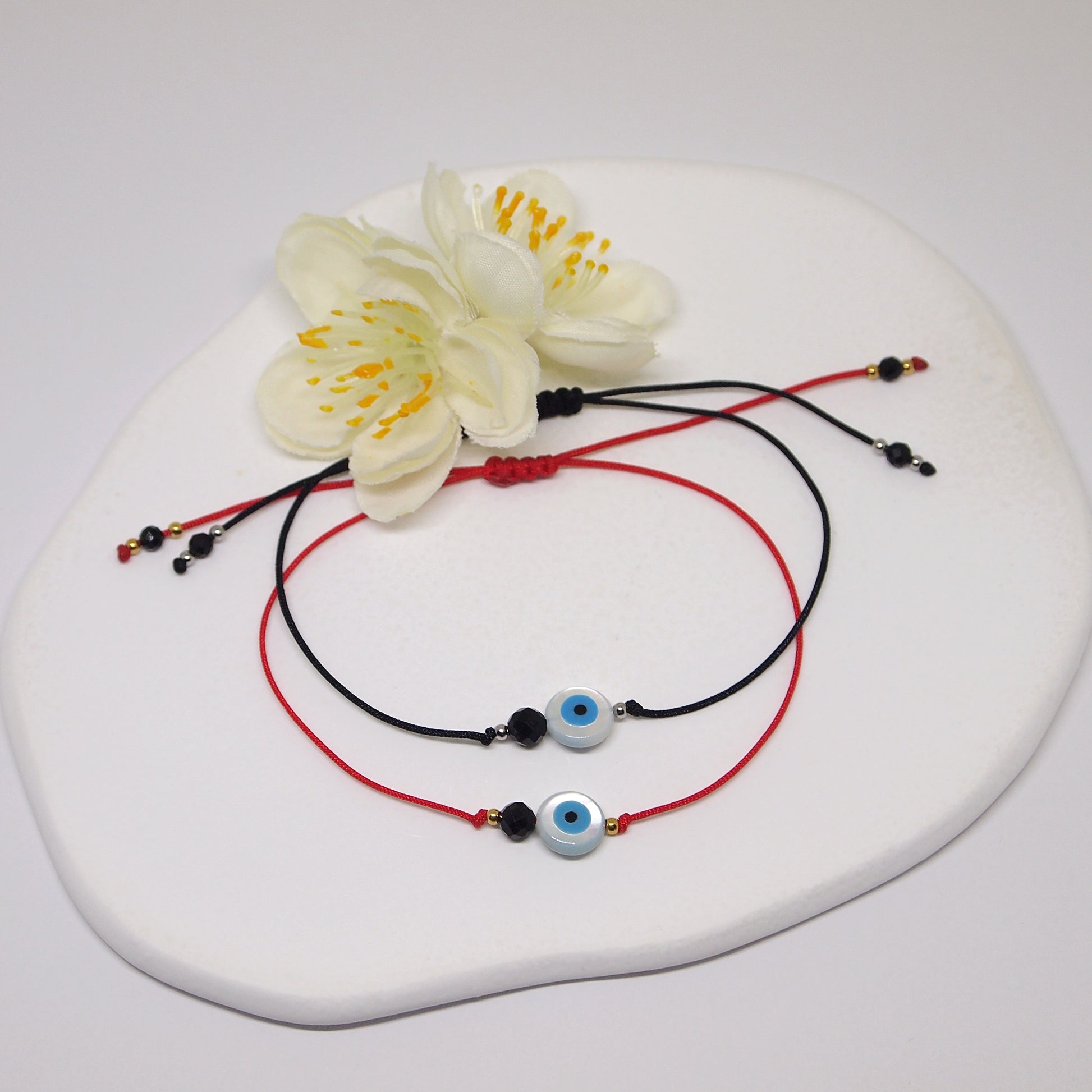 red thread braclet with protection eye and black tourmaline