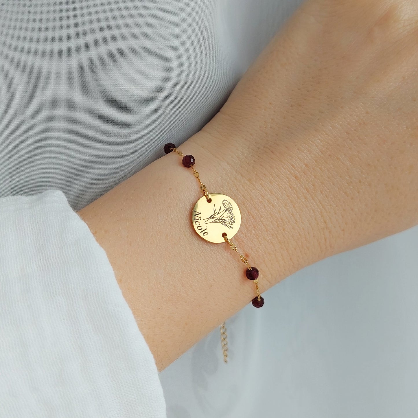 january birthday bracelet with garnet and birth flowers