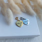 custom personalized stainless steel charms in heart shape, engraved with word or name, can be attached to stretch bracelets, put on chains or other fasteners