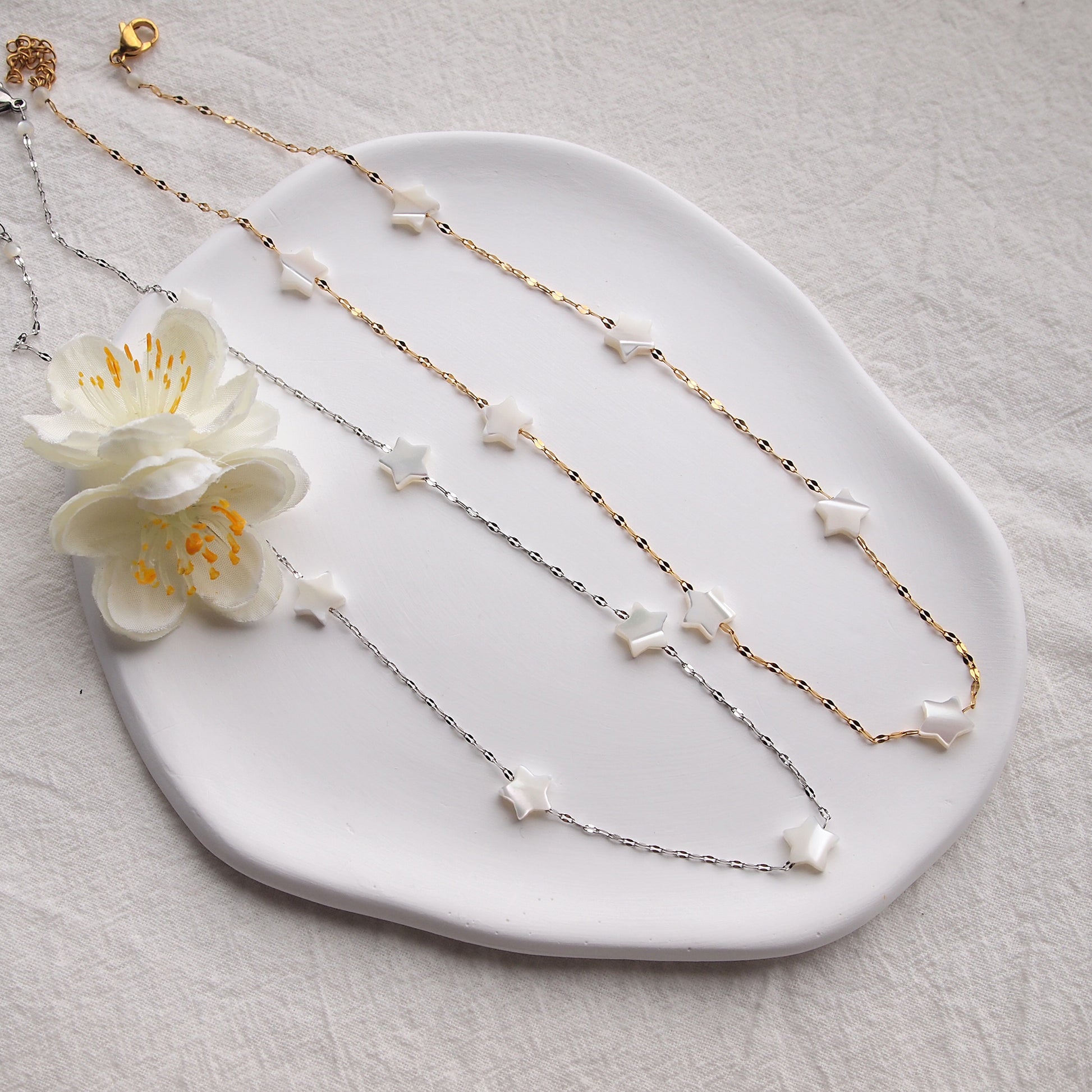 dainty star necklace in gold and silver colors, pearl necklace