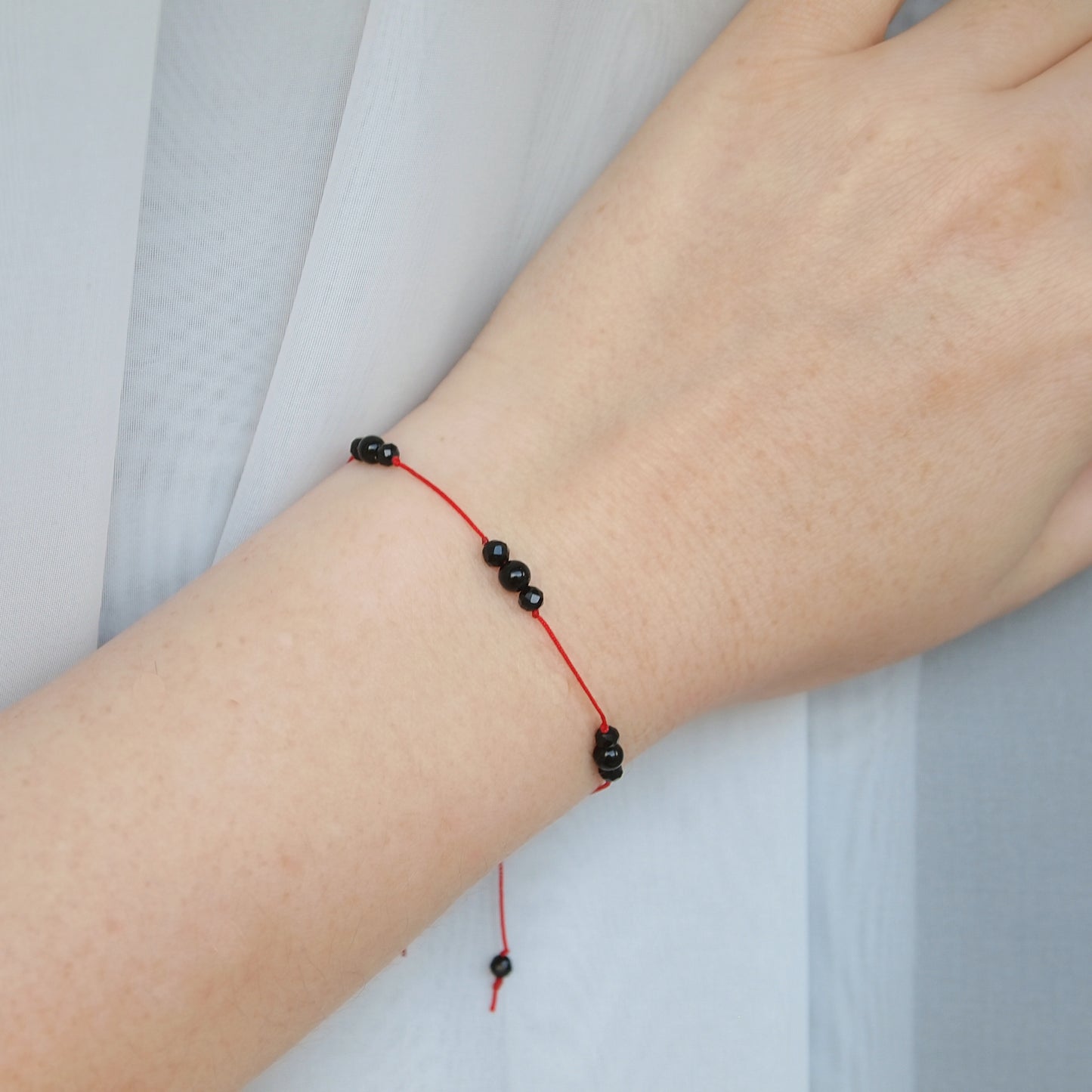 red protection bracelet with black tourmaline