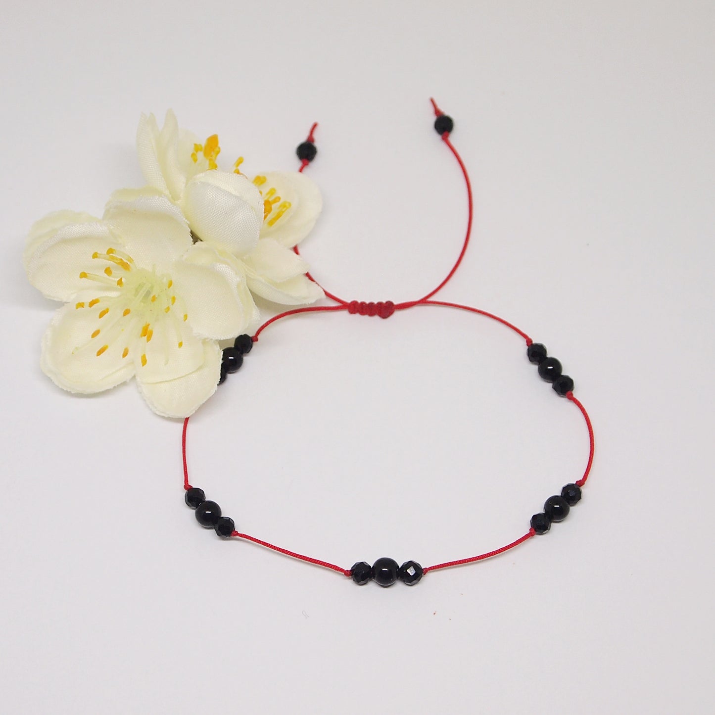 red thread bracelet with black tourmaline for protection