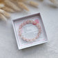 natural rose quartz beaded bracelet on stretch cord with small stainless steel spacer beads, bracelet comes with gemstone information card