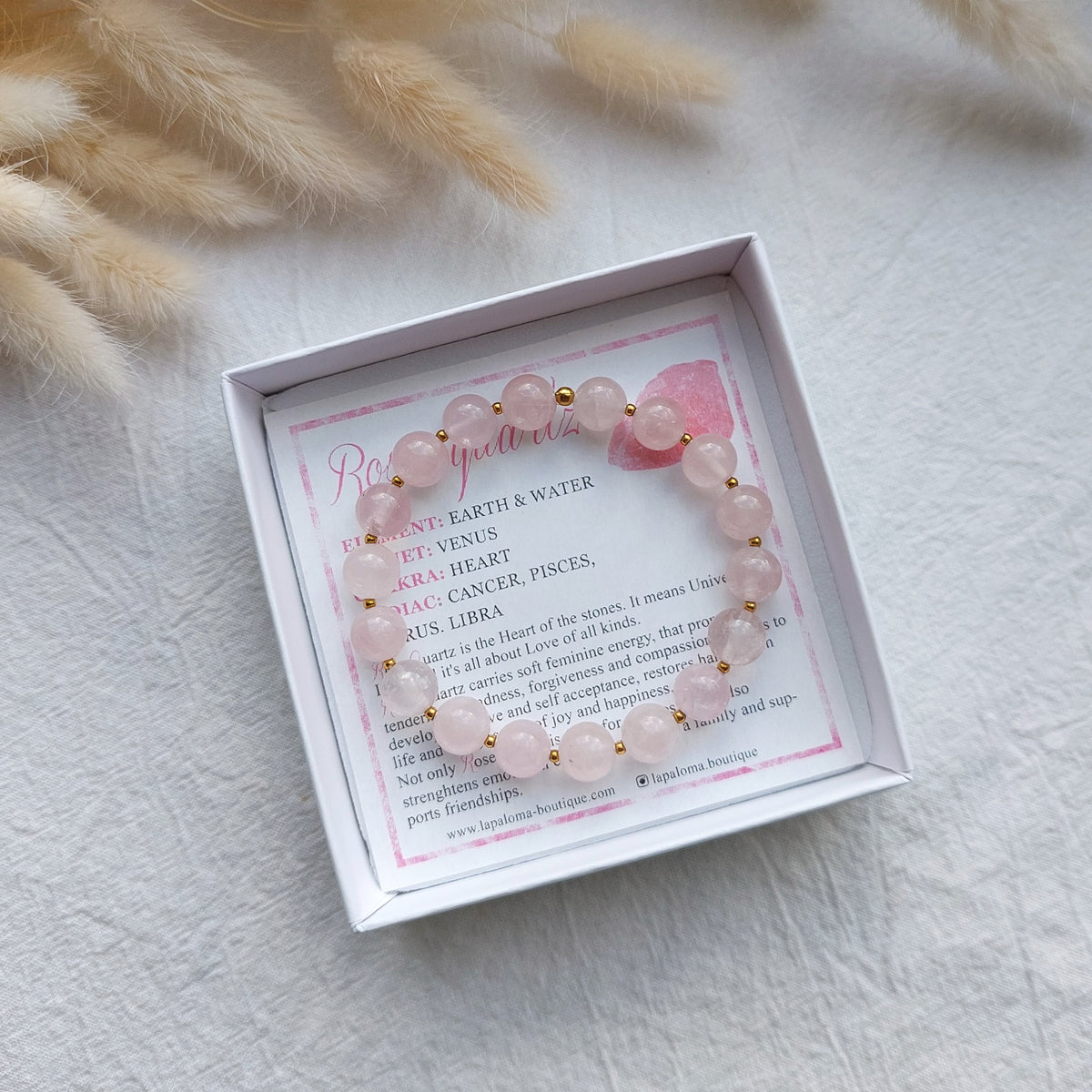natural rose quartz beaded bracelet on stretch cord with small stainless steel spacer beads, bracelet comes with gemstone information card