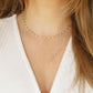 minimal woman necklace with white beads
